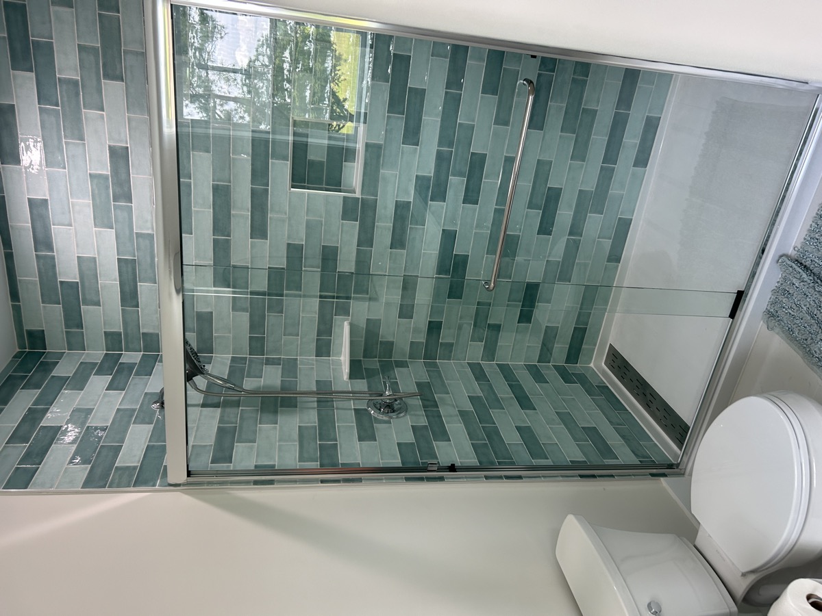 Glass shower door installation photo from Jul 2024