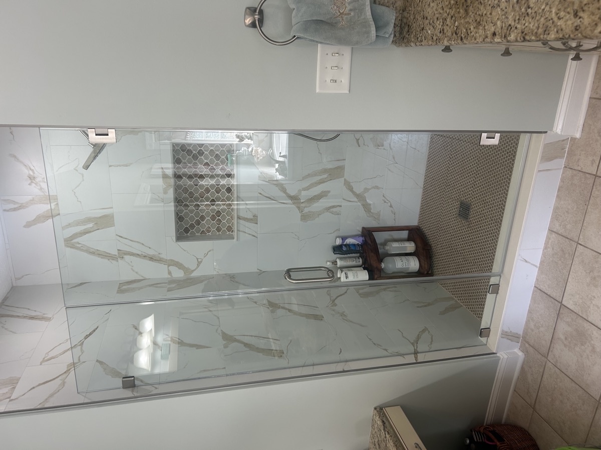 Installed frameless shower door